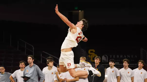 USC men's volleyball opposite hitter Cooper Keane goes up to serve a ball during a match against Stanford at Galen Center