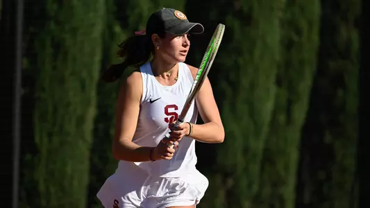 Emma Charney prepares to hit a ball with her tennis racket