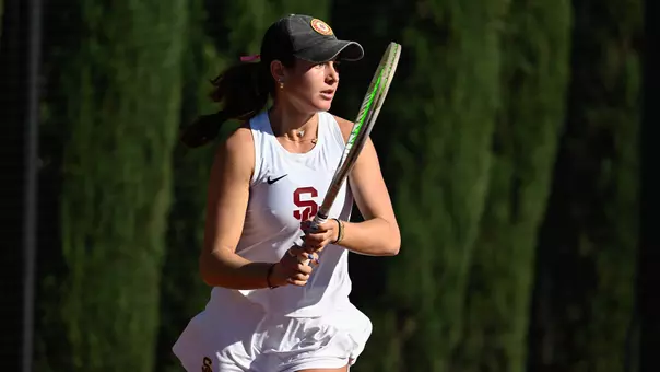 Emma Charney prepares to hit a ball with her tennis racket