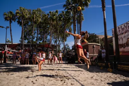 Kennedy Coakley serves a ball against Cal Poly