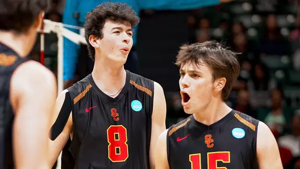 USC men's volleyball setter Andrew Chapin and middle blocker Parker Tomkinson celebrate a point during the NCAA regional round match against Belmont Abbey at Bankoh Arena at Stan Sheriff Center in Honolulu, Hawai'i