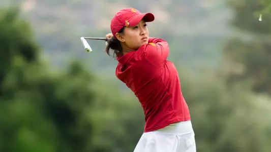 Elise Lee swings an iron at the Big Ten Championships