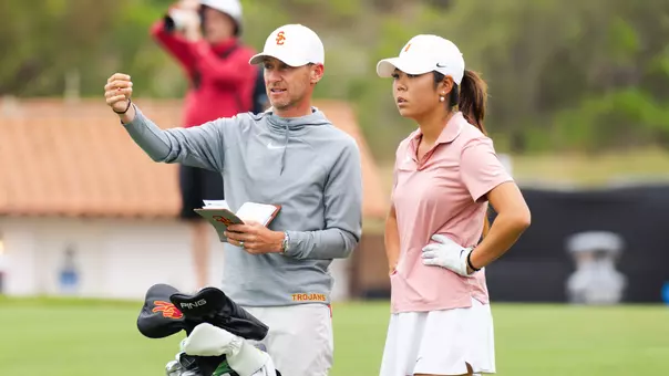 Justin Silverstein instructs Jasmine Koo during the 2026 NCAA Championships