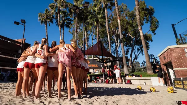 USC beach volleyball huddles at Merle Norman Stadium