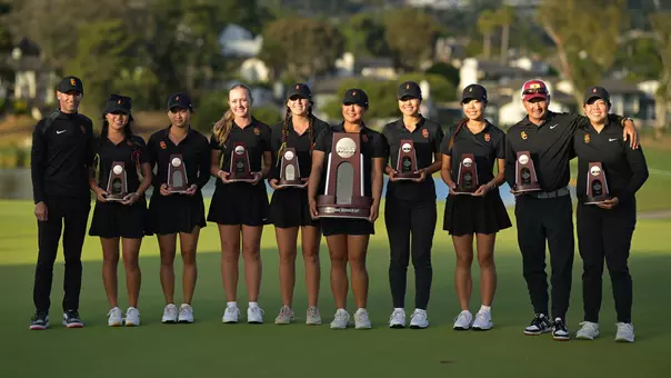 The USC women's golf team poses together with the runner-up trophies after the 2026 NCAA Championships