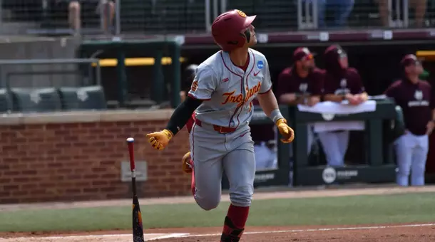 Kevin Takeuchi flips his bat after hitting a grand slam against Texas State
