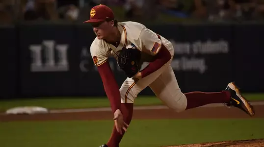 Andrew Johnson pitches to Texas A&M as the starting pitcher for the Trojans