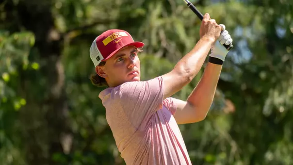 Jack Buchanan swings an iron at the Big Ten Championships