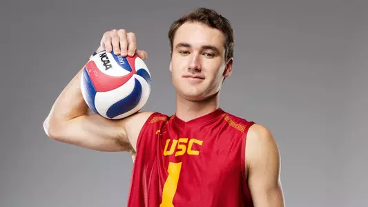 USC men's volleyball outside hitter Dillon Klein poses with a ball on his shoulder during media day