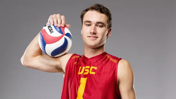 USC men's volleyball outside hitter Dillon Klein poses with a ball on his shoulder during media day