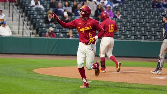 Dean Carpentier reaches home plate after his home run against Nevada.