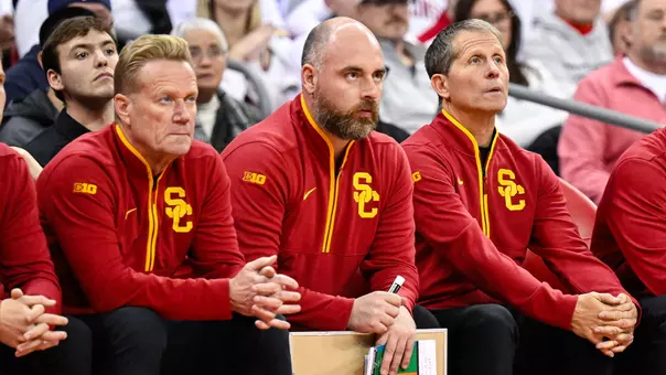 Assistant coach Anthony Ruta sits on the bench during USC Men's Basketball's win at Wisconsin