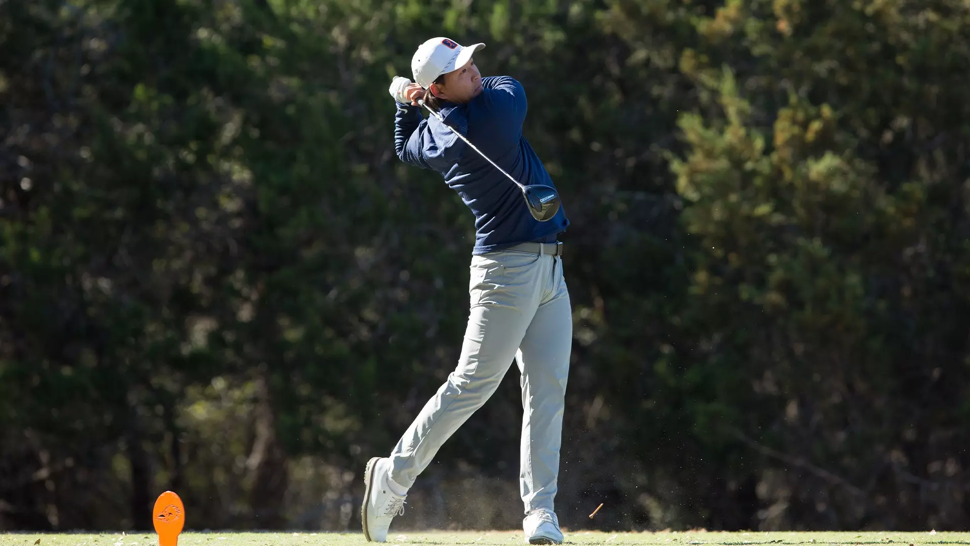 Joshua Hong tees off while playing for UTSA