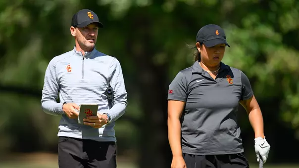 Justin Silverstein and Catherine Park walk the course