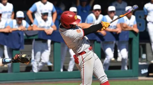 Kevin Takeuchi swinging to get a base hit for the Trojans against UNC in the Super Regionals
