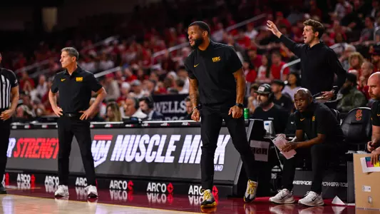 Will Conroy stands by the bench during USC Men's Basketball's game against Nebraska
