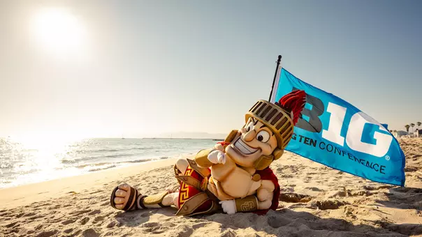 USC Tommy Trojan on beach celebrating Big Ten Conference