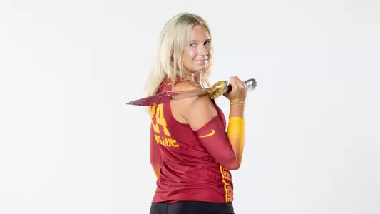 USC women's volleyball setter Milly McGee poses with the Trojan sword during media day