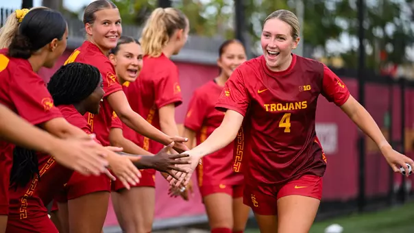 Hadley Snyder high-fives teammates during pregame introductions at Rawlinson Stadium.