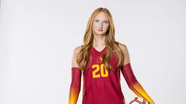 USC women's volleyball freshman middle blocker Addison Coady poses in front of a white wall.