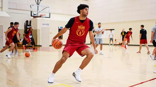 Jacob Cofie dribbles during a summer men's basketball practice
