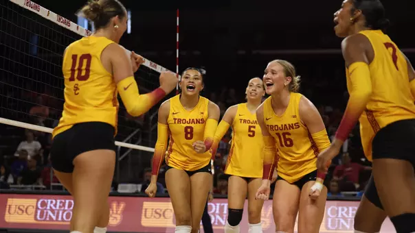 USC women's volleyball players celebrate a point during a match against Oregon State at Galen Center