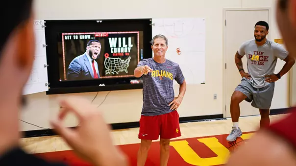 Head coach Eric Musselman presents a slideshow about assistant coach Will Conroy after a summer practice