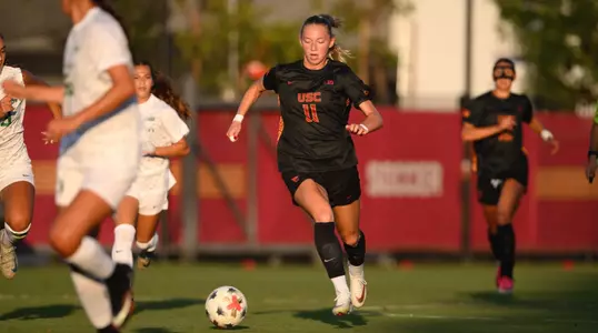 Lily Biddulph dribbles down the field on Friday night against Oregon