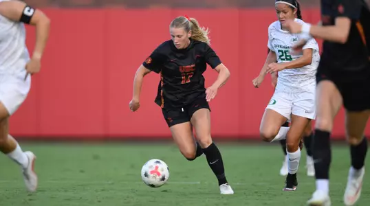 Mary Cochran dribbles the ball down the field during Senior Day