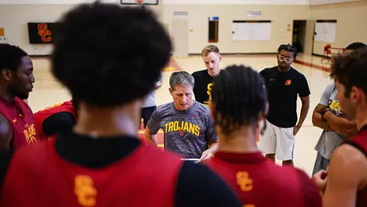 Eric Musselman directs a huddle at practice