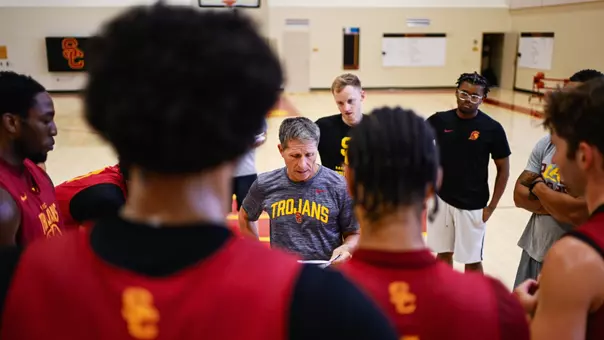 Eric Musselman directs a huddle at practice