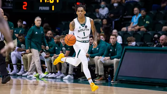 Javon Greene dribbling home