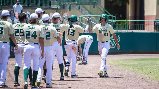 Cantu 2021 gold unis teammates at dugout