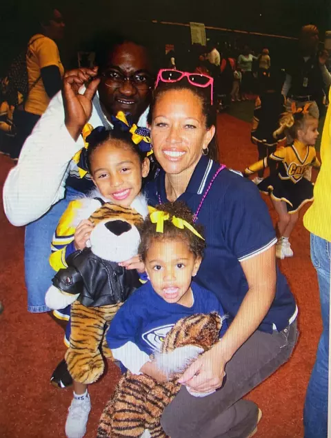 Tieley Vaughn with her family following a childhood cheer competition.