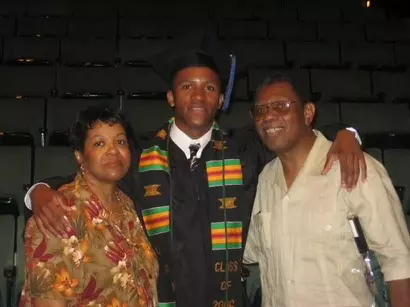 Lee Butler with his parents at his college graduation.