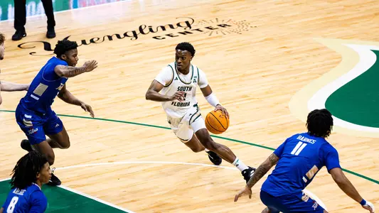 MBB CJ Brown driving to the basket vs Tulsa