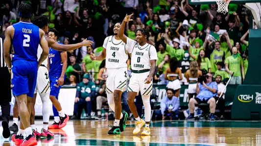 MBB celebration with fans in background vs Tulsa