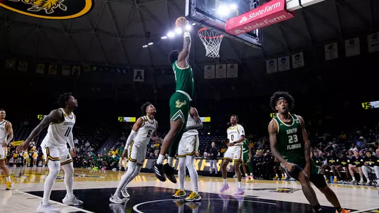 Jamille Reynolds dunk with Quincy Ademokoya celebration at Wichita State