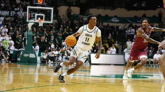 MBB CJ Brown driving to the basket agaisnt Temple