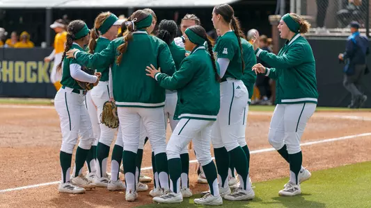 Softball in-game huddle between innings at Wichita State