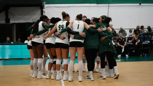 Volleyball team huddle prematch vs Charlotte