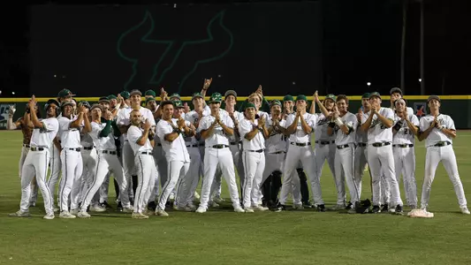 Whole team poses after Jevin Relaford's walk-off to keep postseason hopes alive headed into the final game of the season.