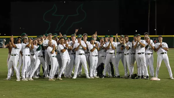 Whole team poses after Jevin Relaford's walk-off to keep postseason hopes alive headed into the final game of the season.