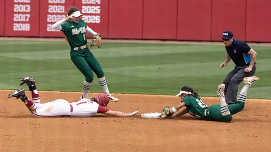 Softball's Kathy Garcia-Soto diving to turn an unassisted double play against Arkansas