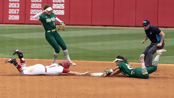 Softball's Kathy Garcia-Soto diving to turn an unassisted double play against Arkansas