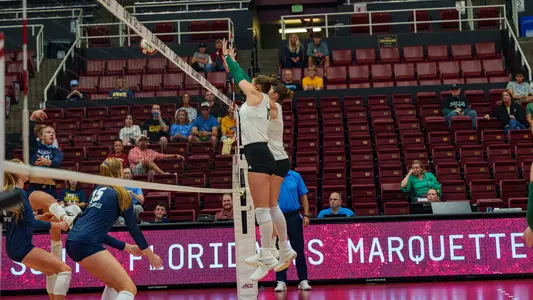 Amelia Wass de Czege with a block against Marquette