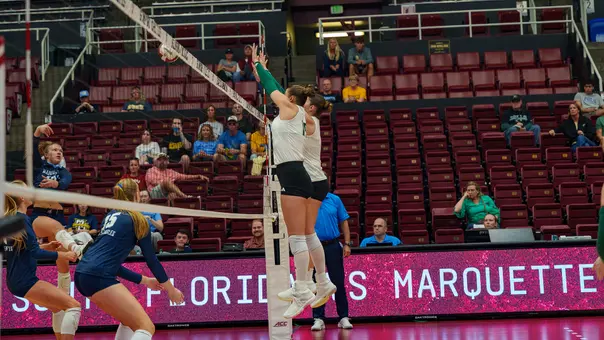 Amelia Wass de Czege with a block against Marquette