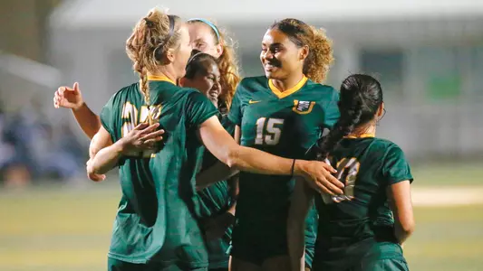 women's soccer celebrates