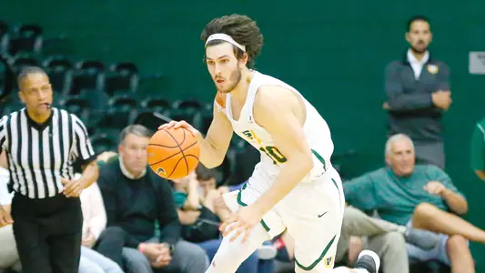 Matt-McCarty-USF-Dons-Mens-Basketball-dribbles-Radford