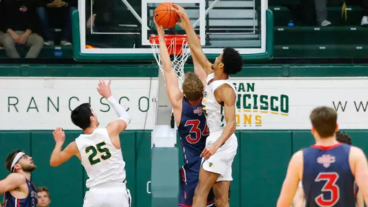 Nate-Renfro-USF-Dons-Men's-Basketball-blocks-SMC's-Jock-Landale